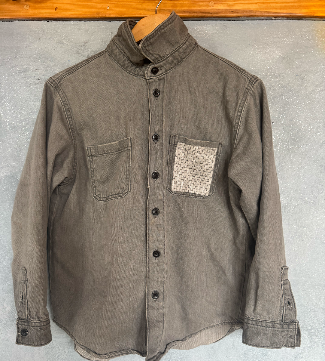 A garment transforming into artwork through mending